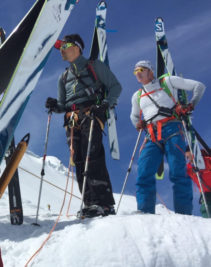 Hikers with ski equipment and other gear