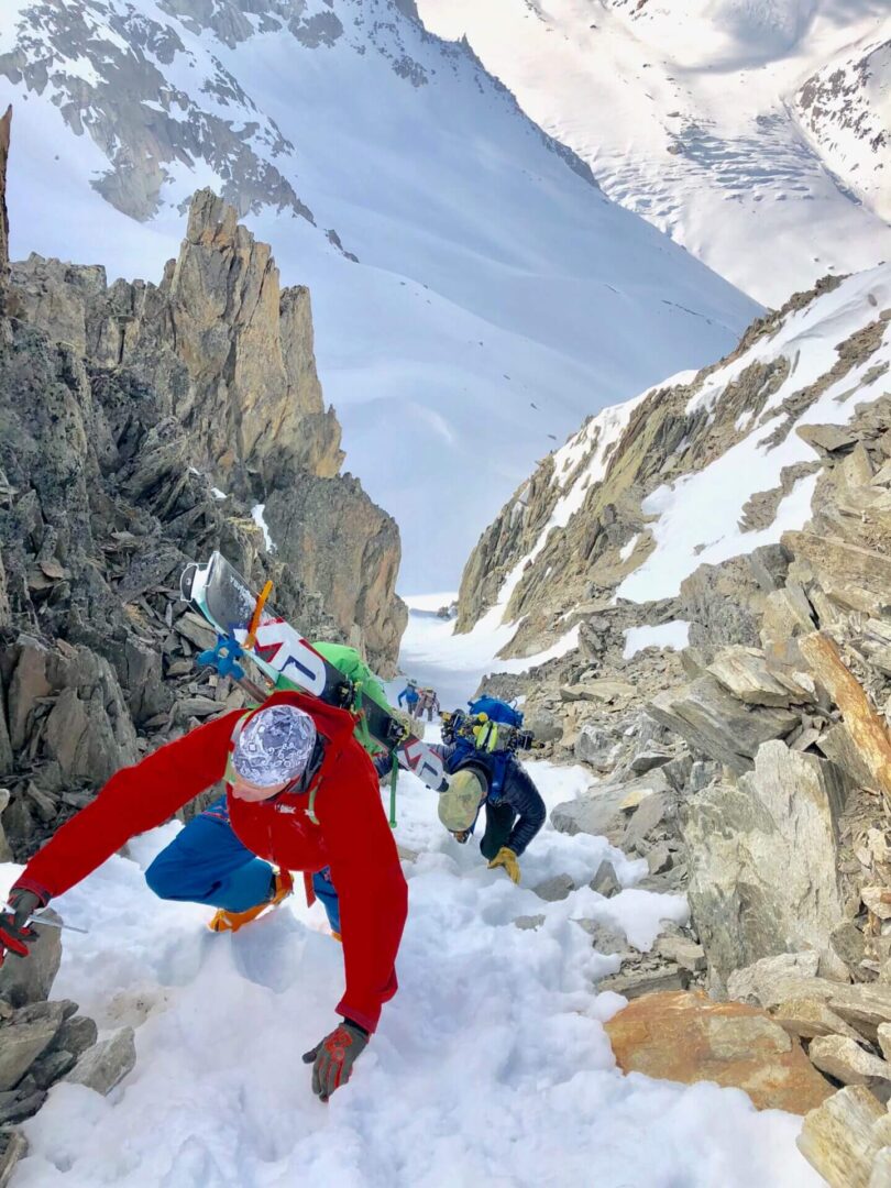 Hikers ascending snowy mountain