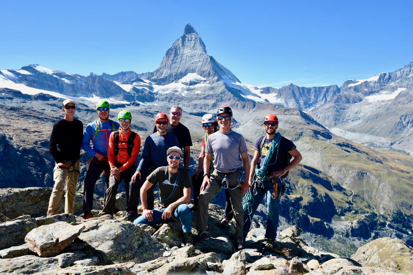 Male hiking group on top of a mountain