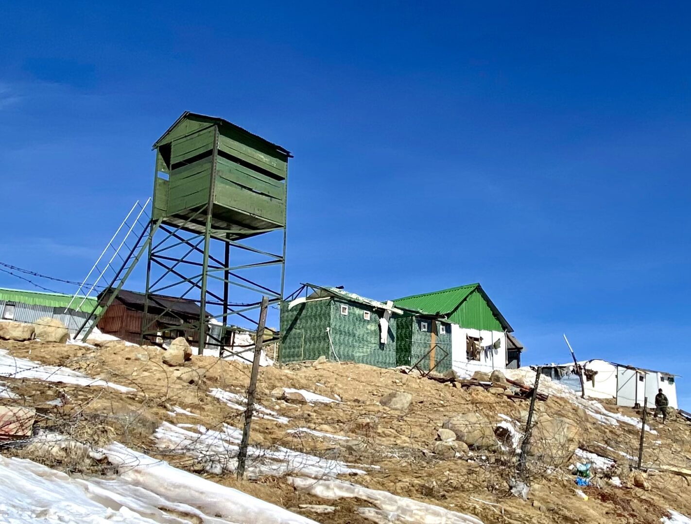 A beautiful house in green color near the mountains